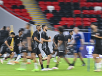 Players of the Qatar National team train at Ahmad Bin Ali Stadium in Al Rayyan, Qatar, on September 4, 2024, on the eve of their Qualificati...