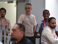 United Arab Emirates national team Head coach Paulo Bento (C) and player Khalifa Al Hammadi (R) arrive for the press conference at Ahmad Bin...