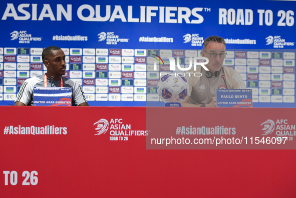 United Arab Emirates national team Head coach Paulo Bento (R) and player Khalifa Al Hammadi (L) attend a press conference at Ahmad Bin Ali S...