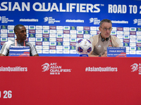 United Arab Emirates national team Head coach Paulo Bento (R) and player Khalifa Al Hammadi (L) attend a press conference at Ahmad Bin Ali S...