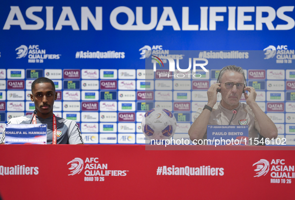 United Arab Emirates national team Head coach Paulo Bento (R) and player Khalifa Al Hammadi (L) attend a press conference at Ahmad Bin Ali S...