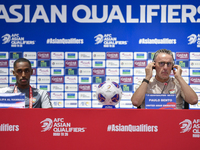 United Arab Emirates national team Head coach Paulo Bento (R) and player Khalifa Al Hammadi (L) attend a press conference at Ahmad Bin Ali S...