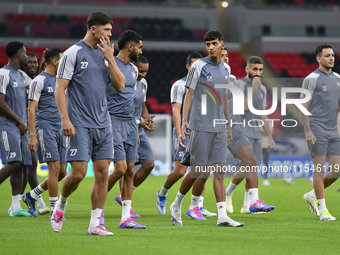 Players of the United Arab Emirates National team train at Ahmad Bin Ali Stadium in Al Rayyan, Qatar, on September 4, 2024, on the eve of th...