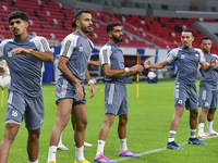 Players of the United Arab Emirates National team train at Ahmad Bin Ali Stadium in Al Rayyan, Qatar, on September 4, 2024, on the eve of th...