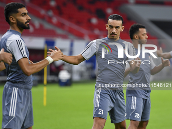 Issam Faiz (C) of the United Arab Emirates National Team trains at Ahmad Bin Ali Stadium in Al Rayyan, Qatar, on September 4, 2024, on the e...