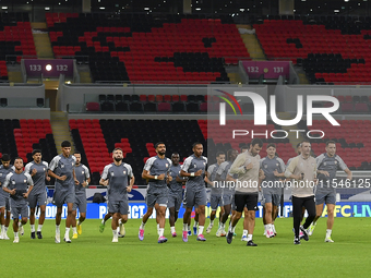 Players of the United Arab Emirates National team train at Ahmad Bin Ali Stadium in Al Rayyan, Qatar, on September 4, 2024, on the eve of th...