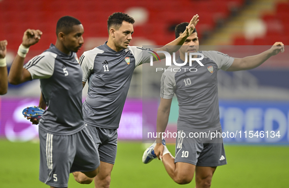 Caio Canedo (C) and Fabio De Lima (R) of the United Arab Emirates National Team train at Ahmad Bin Ali Stadium in Al Rayyan, Qatar, on Septe...