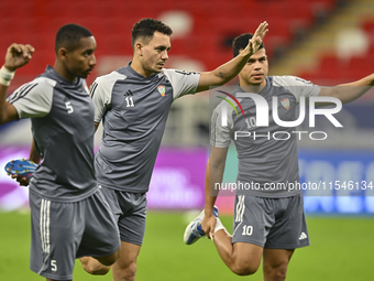 Caio Canedo (C) and Fabio De Lima (R) of the United Arab Emirates National Team train at Ahmad Bin Ali Stadium in Al Rayyan, Qatar, on Septe...