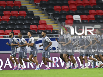 Players of the United Arab Emirates National team train at Ahmad Bin Ali Stadium in Al Rayyan, Qatar, on September 4, 2024, on the eve of th...