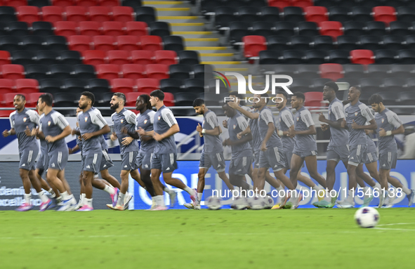 Players of the United Arab Emirates National team train at Ahmad Bin Ali Stadium in Al Rayyan, Qatar, on September 4, 2024, on the eve of th...