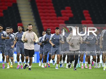 Players of the United Arab Emirates National team train at Ahmad Bin Ali Stadium in Al Rayyan, Qatar, on September 4, 2024, on the eve of th...