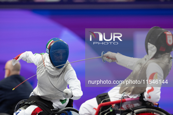 Beatrice Maria ''Bebe'' Vio Grandis of Italy competes against Rong Xiao of China during the Women's Foil Category B Semifinal at Gran Palais...