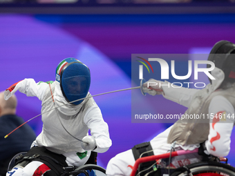 Beatrice Maria ''Bebe'' Vio Grandis of Italy competes against Rong Xiao of China during the Women's Foil Category B Semifinal at Gran Palais...