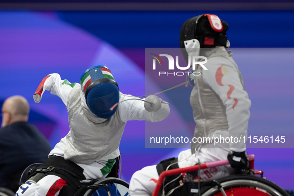 Beatrice Maria ''Bebe'' Vio Grandis of Italy competes against Rong Xiao of China during the Women's Foil Category B Semifinal at Gran Palais...