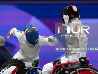 Beatrice Maria ''Bebe'' Vio Grandis of Italy competes against Rong Xiao of China during the Women's Foil Category B Semifinal at Gran Palais...