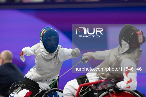 Beatrice Maria ''Bebe'' Vio Grandis of Italy competes against Rong Xiao of China during the Women's Foil Category B Semifinal at Gran Palais...