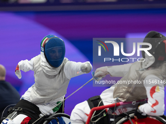 Beatrice Maria ''Bebe'' Vio Grandis of Italy competes against Rong Xiao of China during the Women's Foil Category B Semifinal at Gran Palais...