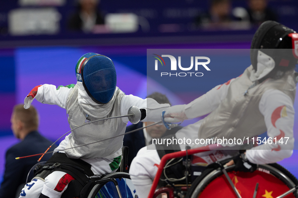 Beatrice Maria ''Bebe'' Vio Grandis of Italy competes against Rong Xiao of China during the Women's Foil Category B Semifinal at Gran Palais...