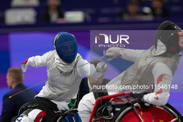 Beatrice Maria ''Bebe'' Vio Grandis of Italy competes against Rong Xiao of China during the Women's Foil Category B Semifinal at Gran Palais...