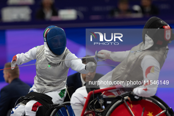 Beatrice Maria ''Bebe'' Vio Grandis of Italy competes against Rong Xiao of China during the Women's Foil Category B Semifinal at Gran Palais...