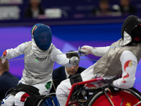 Beatrice Maria ''Bebe'' Vio Grandis of Italy competes against Rong Xiao of China during the Women's Foil Category B Semifinal at Gran Palais...