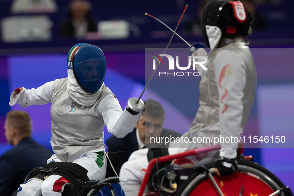 Beatrice Maria ''Bebe'' Vio Grandis of Italy competes against Rong Xiao of China during the Women's Foil Category B Semifinal at Gran Palais...