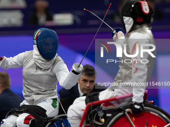 Beatrice Maria ''Bebe'' Vio Grandis of Italy competes against Rong Xiao of China during the Women's Foil Category B Semifinal at Gran Palais...