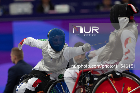 Beatrice Maria ''Bebe'' Vio Grandis of Italy competes against Rong Xiao of China during the Women's Foil Category B Semifinal at Gran Palais...