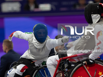 Beatrice Maria ''Bebe'' Vio Grandis of Italy competes against Rong Xiao of China during the Women's Foil Category B Semifinal at Gran Palais...