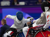 Beatrice Maria ''Bebe'' Vio Grandis of Italy competes against Rong Xiao of China during the Women's Foil Category B Semifinal at Gran Palais...