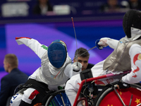 Beatrice Maria ''Bebe'' Vio Grandis of Italy competes against Rong Xiao of China during the Women's Foil Category B Semifinal at Gran Palais...