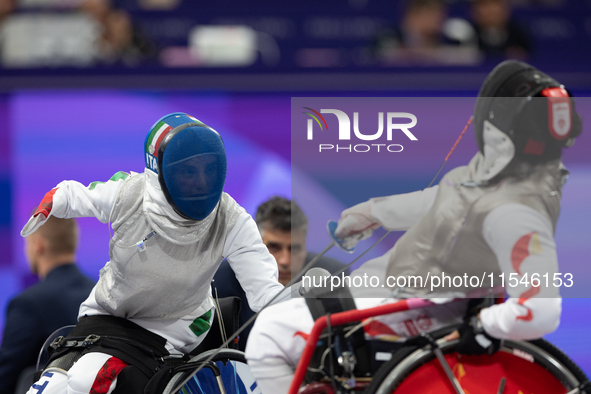 Beatrice Maria ''Bebe'' Vio Grandis of Italy competes against Rong Xiao of China during the Women's Foil Category B Semifinal at Gran Palais...