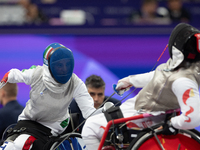 Beatrice Maria ''Bebe'' Vio Grandis of Italy competes against Rong Xiao of China during the Women's Foil Category B Semifinal at Gran Palais...