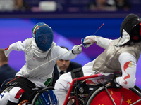 Beatrice Maria ''Bebe'' Vio Grandis of Italy competes against Rong Xiao of China during the Women's Foil Category B Semifinal at Gran Palais...