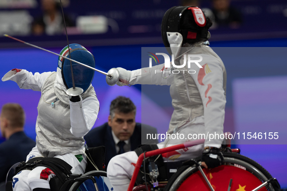 Beatrice Maria ''Bebe'' Vio Grandis of Italy competes against Rong Xiao of China during the Women's Foil Category B Semifinal at Gran Palais...