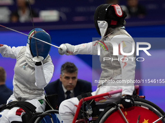 Beatrice Maria ''Bebe'' Vio Grandis of Italy competes against Rong Xiao of China during the Women's Foil Category B Semifinal at Gran Palais...