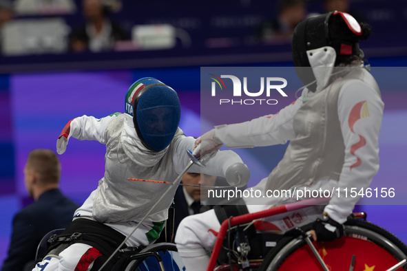 Beatrice Maria ''Bebe'' Vio Grandis of Italy competes against Rong Xiao of China during the Women's Foil Category B Semifinal at Gran Palais...