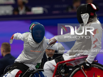 Beatrice Maria ''Bebe'' Vio Grandis of Italy competes against Rong Xiao of China during the Women's Foil Category B Semifinal at Gran Palais...