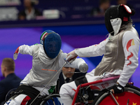 Beatrice Maria ''Bebe'' Vio Grandis of Italy competes against Rong Xiao of China during the Women's Foil Category B Semifinal at Gran Palais...