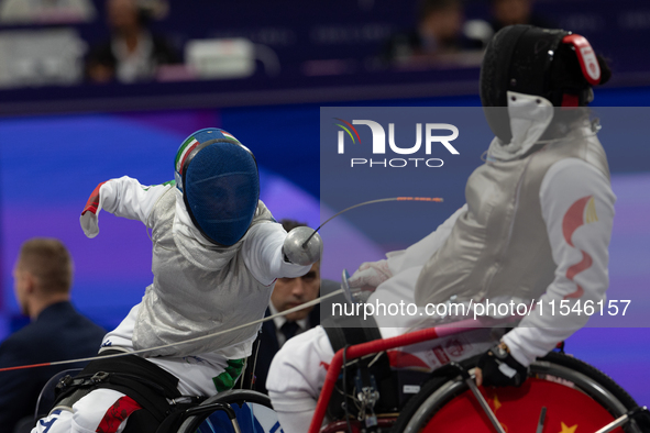 Beatrice Maria ''Bebe'' Vio Grandis of Italy competes against Rong Xiao of China during the Women's Foil Category B Semifinal at Gran Palais...