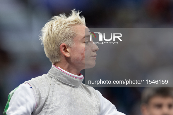 Beatrice Maria ''Bebe'' Vio Grandis of Italy reacts after she loses against Rong Xiao of China during the Women's Foil Category B Semifinal...