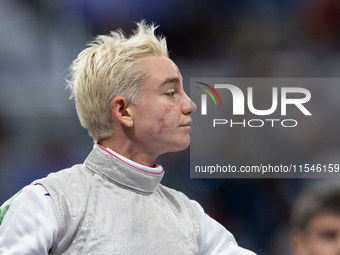 Beatrice Maria ''Bebe'' Vio Grandis of Italy reacts after she loses against Rong Xiao of China during the Women's Foil Category B Semifinal...