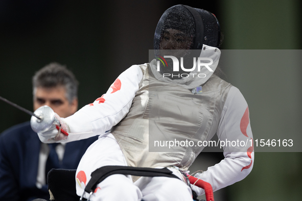 Rong Xiao of China and Beatrice Maria ''Bebe'' Vio Grandis of Italy compete during the Women's Foil Category B Semifinal at Gran Palais duri...