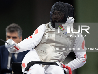 Rong Xiao of China and Beatrice Maria ''Bebe'' Vio Grandis of Italy compete during the Women's Foil Category B Semifinal at Gran Palais duri...