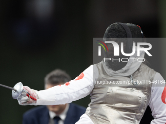 Rong Xiao of China and Beatrice Maria ''Bebe'' Vio Grandis of Italy compete during the Women's Foil Category B Semifinal at Gran Palais duri...