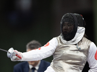 Rong Xiao of China and Beatrice Maria ''Bebe'' Vio Grandis of Italy compete during the Women's Foil Category B Semifinal at Gran Palais duri...