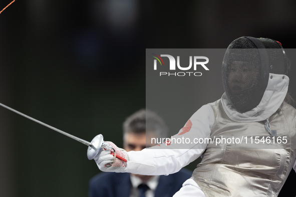 Rong Xiao of China and Beatrice Maria ''Bebe'' Vio Grandis of Italy compete during the Women's Foil Category B Semifinal at Gran Palais duri...