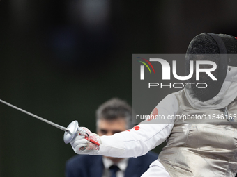 Rong Xiao of China and Beatrice Maria ''Bebe'' Vio Grandis of Italy compete during the Women's Foil Category B Semifinal at Gran Palais duri...