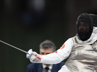 Rong Xiao of China and Beatrice Maria ''Bebe'' Vio Grandis of Italy compete during the Women's Foil Category B Semifinal at Gran Palais duri...