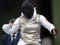 Rong Xiao of China and Beatrice Maria ''Bebe'' Vio Grandis of Italy compete during the Women's Foil Category B Semifinal at Gran Palais duri...